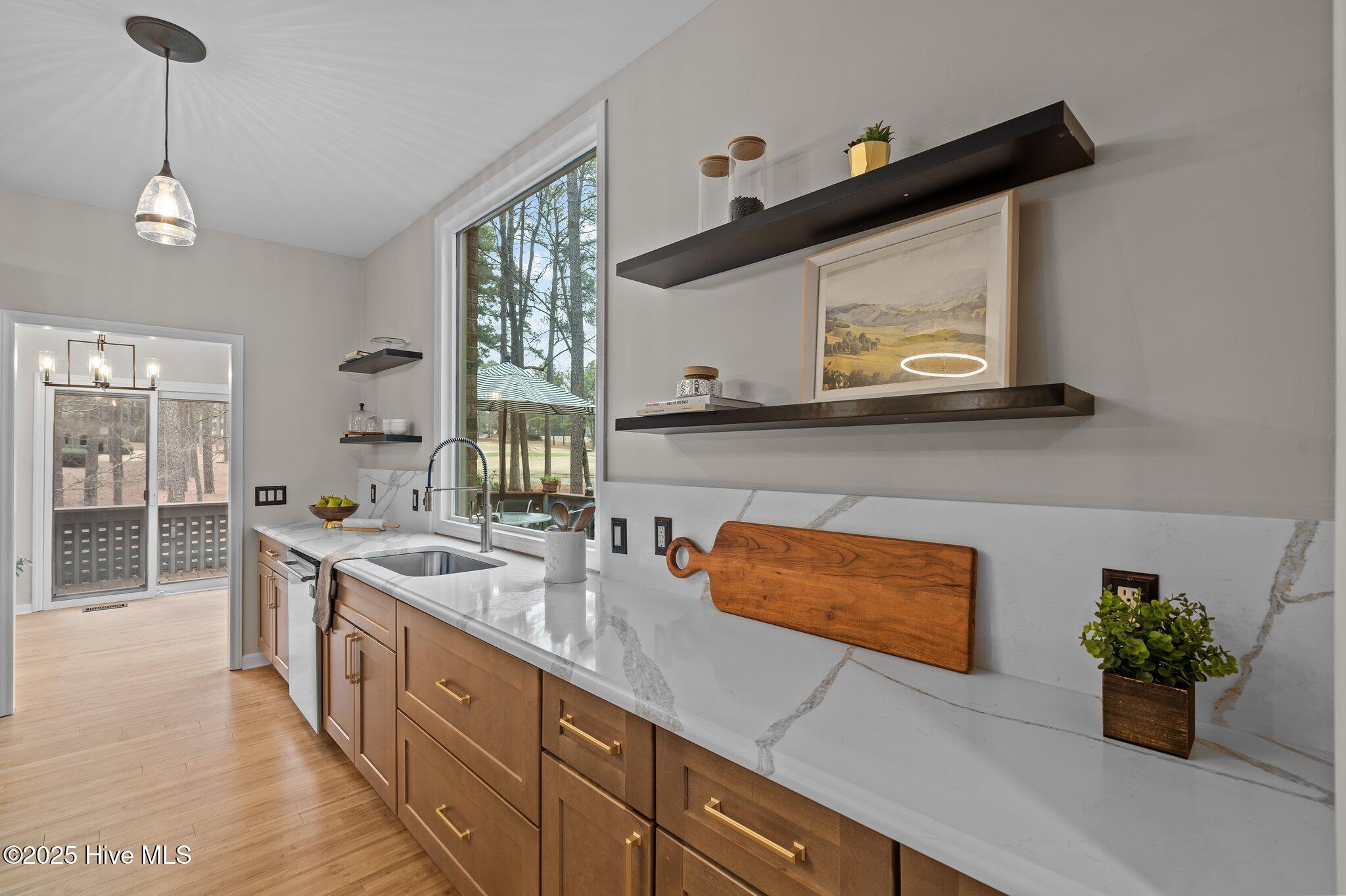 Kitchen flows to the breakfast nook and deck