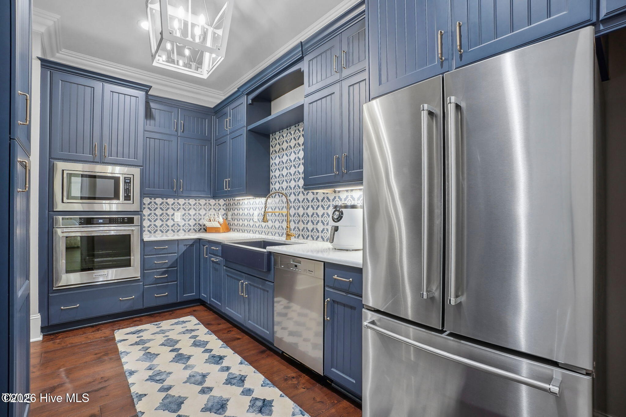 Scullery off the kitchen includes multiple KitchenAid appliances Mila dishwasher backup KitchenAid F