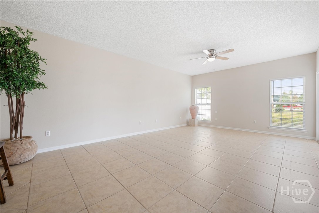 Large window and a door leads to the patio.