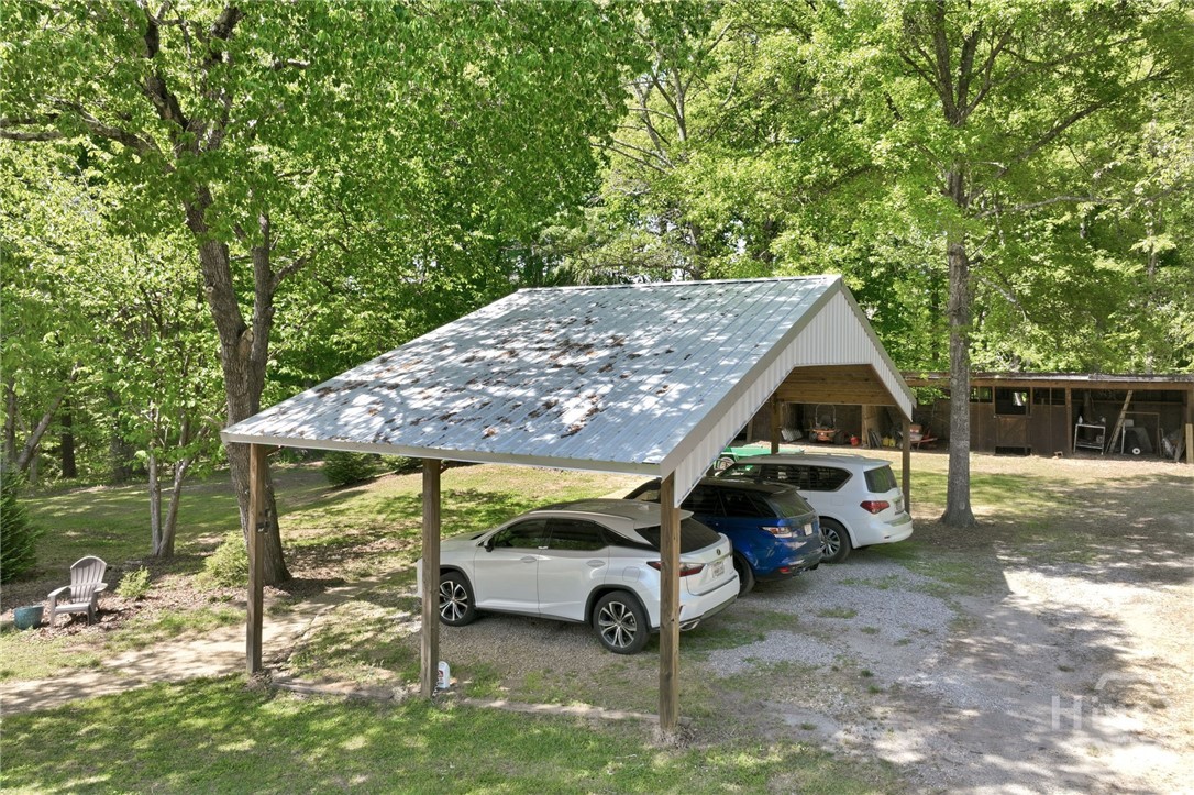 View of pole barn for parking 3 large cars/trucks