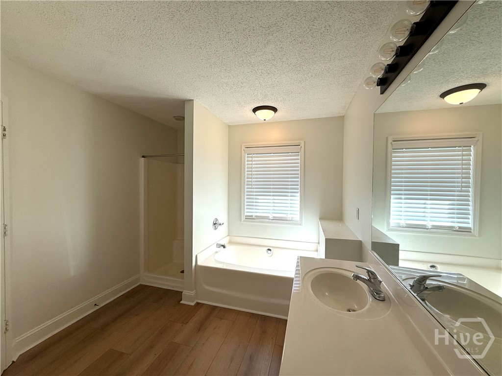 MASTER BATHROOM WITH SOAKING TUB AND SEPARATE SHOW