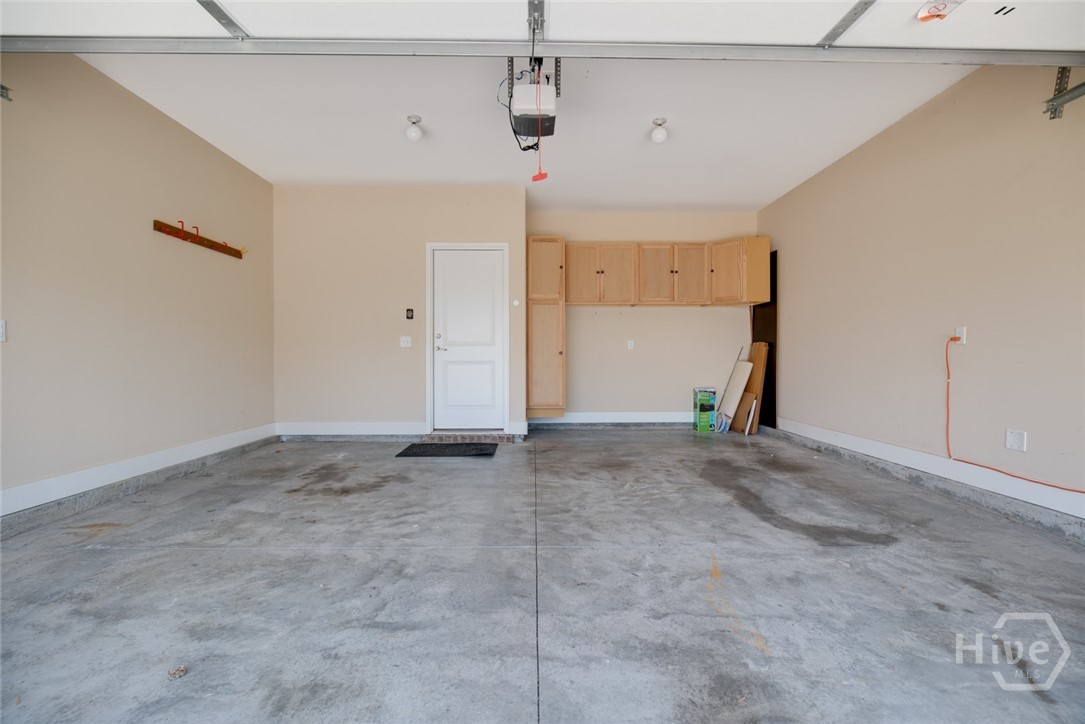 2 car garage with custom cabinetry