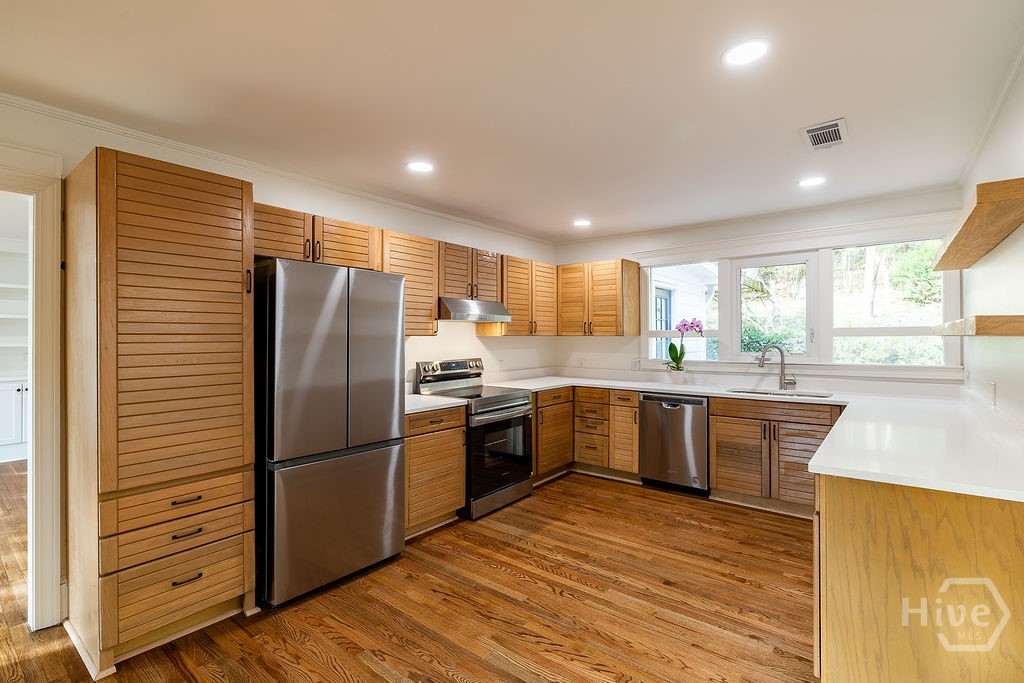 Kitchen overlooking backyard with Koi Pond