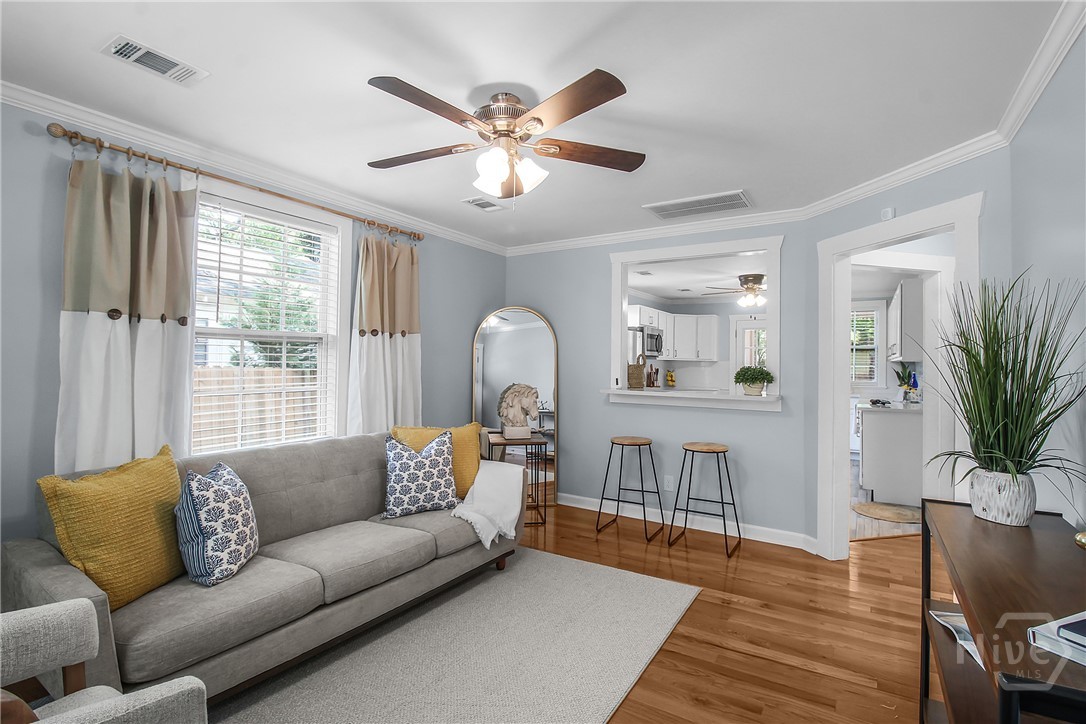 Quaint, cozy living room seamlessly opens to the k