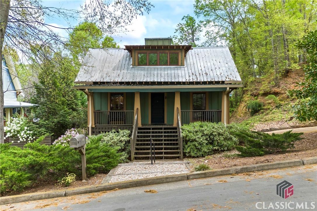 Nestled in the heart of Athens' cherished Pulaski Heights neighborhood, this enchanting Craftsman-style home seamlessly blends historic charm with modern comforts. Built in 2005, the residence offers 4 bedrooms and 3 bathrooms over 2,000 square feet of thoughtfully designed living space.
As you step inside, rich hardwood floors guide you through the main living spaces, radiating warmth and timeless elegance. Expansive windows flood the home with natural light, accentuating its charming architectural details and creating an inviting, airy ambiance. Plus, with fiber internet wiring, you’ll enjoy lightning-fast connectivity for work, streaming, and everything in between.

The open-concept living and dining areas provide an ideal setting for both intimate gatherings and lively entertaining. The kitchen boasts excellent cabinetry, high ceilings, and a pantry, catering to both form and function. 

Retreat to the spacious bedrooms, each offering comfort and tranquility. The main floor primary suite features a well-appointed en-suite bathroom, Bonus 2nd floor bedroom with en-suite bathroom ensuring a private oasis for relaxation.

Situated just blocks from Downtown Athens, this home offers unparalleled access to the city's vibrant music scene, eclectic dining, and boutique shopping. Experience the perfect blend of historic character and contemporary living in this captivating Athens residence.