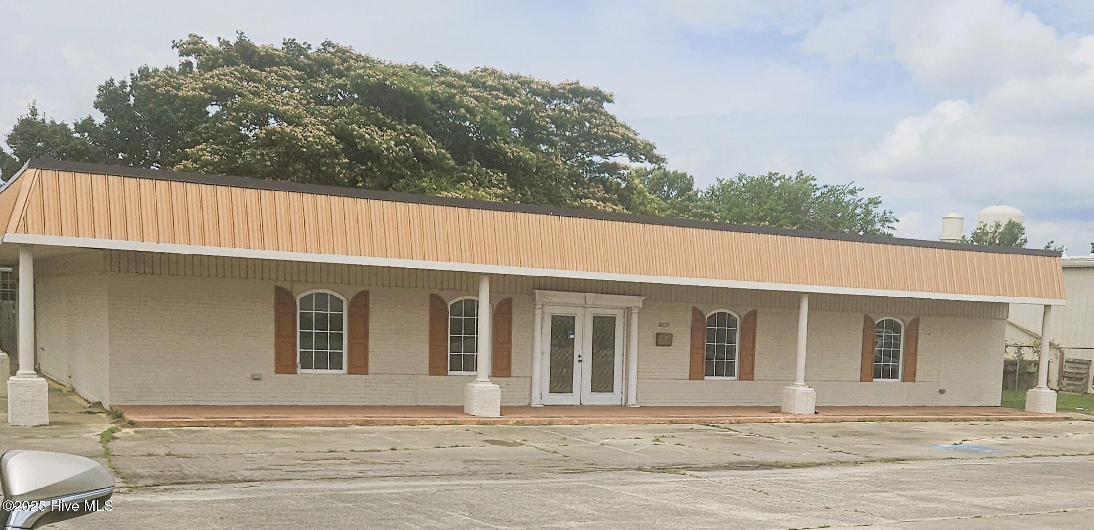A steal of a deal for this Commercial Building with Parking and on a corner lot.  Can be finished to be a Funeral Home.  Interior structure plan for that.   Could be a day care, etc.  Interior needs to be finished.