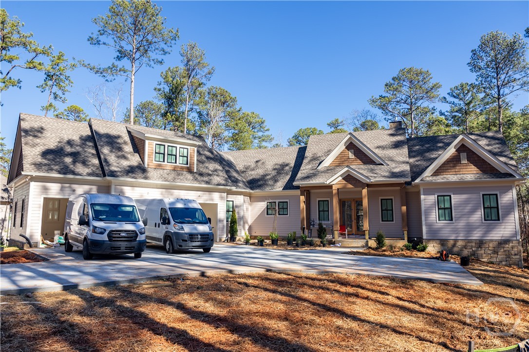 Completed March 2026 and ready for the lake season, this new construction home by Right Angle Construction offers lake access with a dedicated shared dock in Reynolds Lake Oconee. Featuring 6,324 sq ft, the home includes 5 bedrooms, 5 full baths, and 2 half baths with an open-concept layout, high-end finishes, and abundant natural light.The gourmet kitchen opens to the great room with one fireplace and access to covered outdoor living and a pool, creating seamless indoor-outdoor flow. The primary suite offers a spa-style bath, while additional ensuite bedrooms and flexible living spaces provide versatility.A Golf Membership is available. Offered at $3,495,000, this move-in-ready lake-access home delivers new construction, dock access, and resort-style living at Reynolds Lake Oconee.