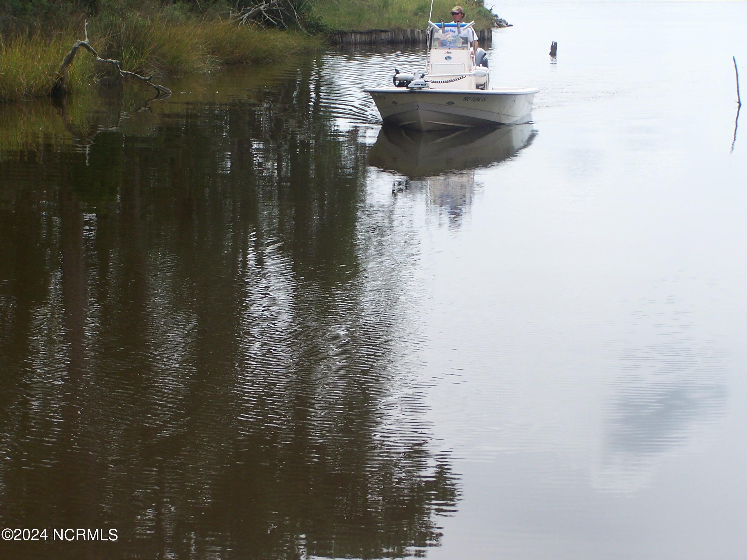 Boat navigating Mill Creek