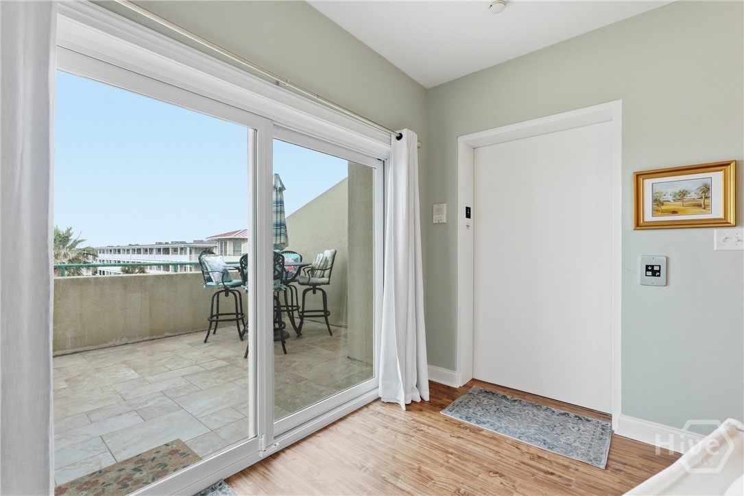 Large glass sliding door leads to Balcony with Atl