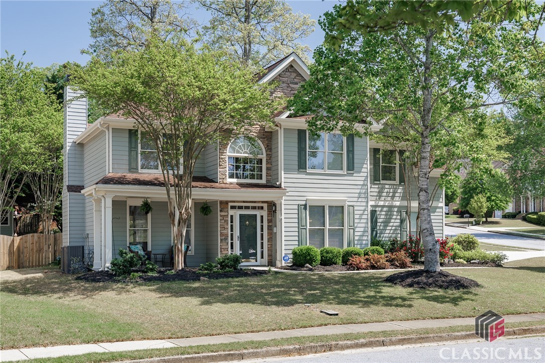 Welcome to this beautiful corner-lot home in Knollwood Lakes, perfectly positioned across from the neighborhood clubhouse and pool. Relax on the inviting rocking chair front porch or enjoy the backyard, complete with a versatile storage shed. The main level features a separate dining room, living room, and a cozy family room with fireplace and newer built-ins. The spacious kitchen offers an oversized island, ample cabinetry, and stainless steel appliances.Upstairs, the primary suite includes a sitting area and dual walk-in closets. The ensuite bathroom has been completely updated with custom lighting, tile floors, a soaking tub, a separate shower, and a double vanity. Two additional bedrooms and a full bathroom are also located upstairs, along with a versatile loft space—complete with a closet and window—that can easily be converted into a fourth bedroom. New carpet upstairs adds a fresh touch.This home offers both style and functionality in a sought-after neighborhood.