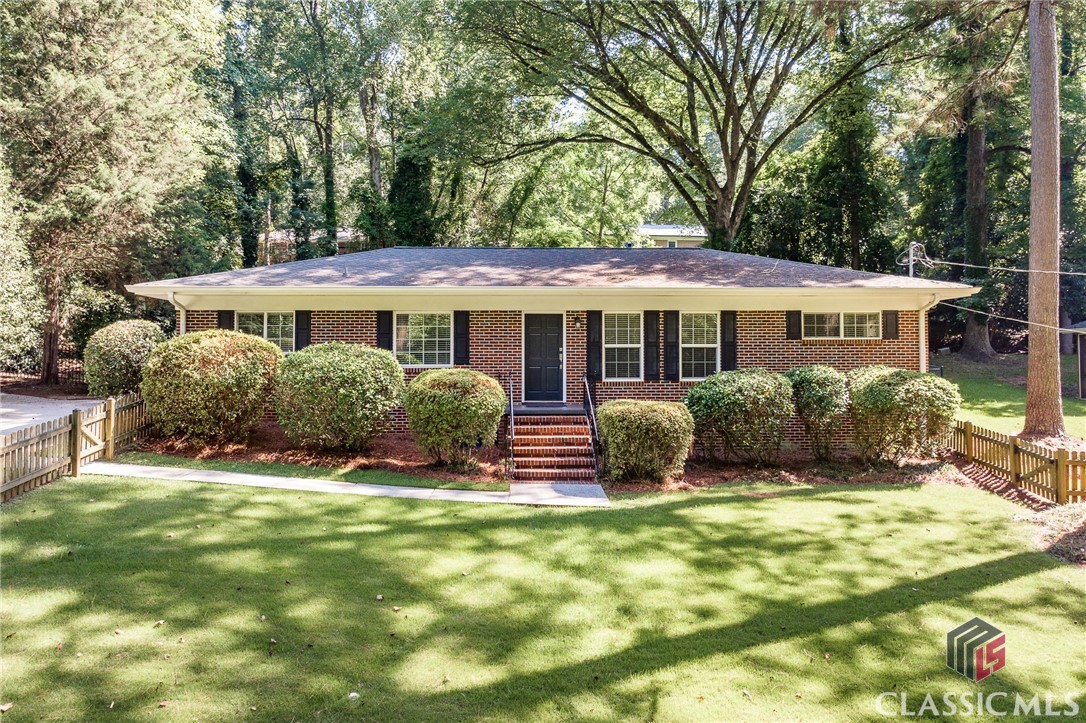 Act fast on this turn-key home close to everything Athens has to offer! Five minutes to Downtown Athens and UGA, moments from Beechwood Shopping Center, and a quick trip to Five Points. A cute picket fence in the front yard greets you as you approach the home. Original hardwood flooring throughout the home including all bedrooms. There's nothing you'll need to update in this home as the electrical panel has been upgraded, newer duct work, PEX plumbing supply lines, water heater (2021), and newer guest bathroom with granite counters. Living room features built-ins and is adjacent to the formal dining room. Spacious eat-in kitchen has a breakfast bar, additional dining space, and all appliances remaining. Spacious Primary Suite features tiled ensuite bathroom and lots of closet space. The fenced backyard features a storage building and sizable patio space for entertaining. 225 Riverside Drive is located at the end of a rarely traversed street and has a very private setting that includes woods and a creek across the street perfect for exploring! Meticulously maintained and move-in ready!