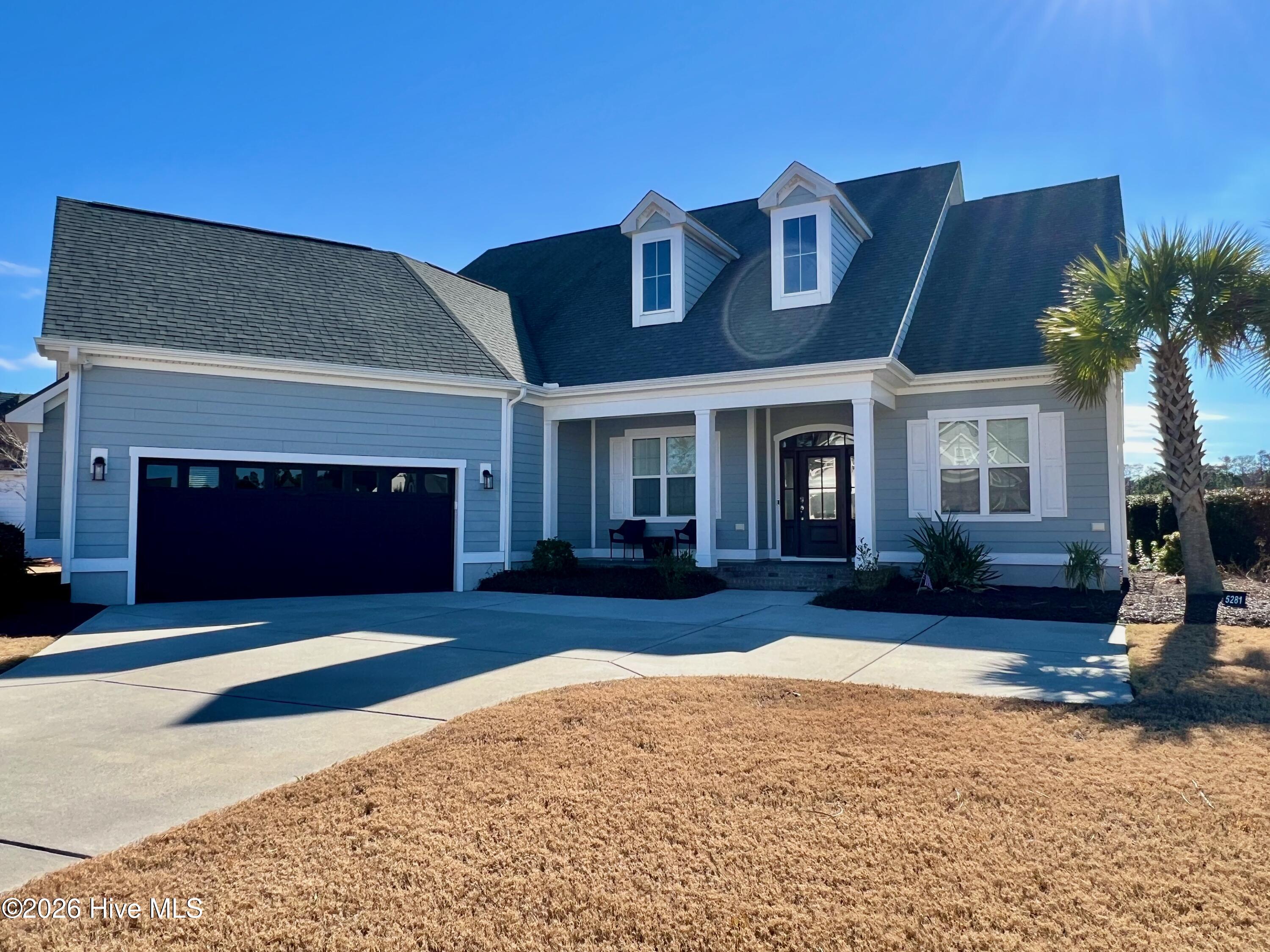 This exceptional residence is located within The Lakes at Brunswick Forest and offers 2,989 sq ft of meticulously designed living space on a spacious 13,939 sq ft lot. Featuring an east-facing backyard, the home provides picturesque morning views over the waterfront lake. The main floor showcases a contemporary open layout that seamlessly connects the kitchen, dining area, sitting area, and family room, providing an ideal setting for both daily living and entertaining. The Jones Port by Kent Homes comprises three well-proportioned bedrooms and two and a half bathrooms, striking a careful balance between comfort and style. A designated sitting area creates a serene atmosphere for relaxation or enjoying the lake scenery. The private office, equipped with nine-foot coffered ceilings and glass double doors, is thoughtfully designed for remote professionals or those seeking privacy for focused work or study. Additional interior amenities include a generous walk-in pantry and a climate-controlled storage room, suitable for larger belongings or custom wine storage. Upstairs, the finished game room offers recreational opportunities with a pool table and wet bar—an excellent space for gatherings. Outdoor features include a built-in natural gas grill, enhancing options for outdoor dining and lakeside entertainment. Notable upgrades such as a tankless water heater and a Generac generator ensure added convenience and reliability. The property is partially furnished, facilitating a seamless move-in process for those seeking refined lakeside living. Residents of Brunswick Forest Community benefit from amenities including indoor and outdoor swimming pools, pickleball courts, a gym, and a golf course.