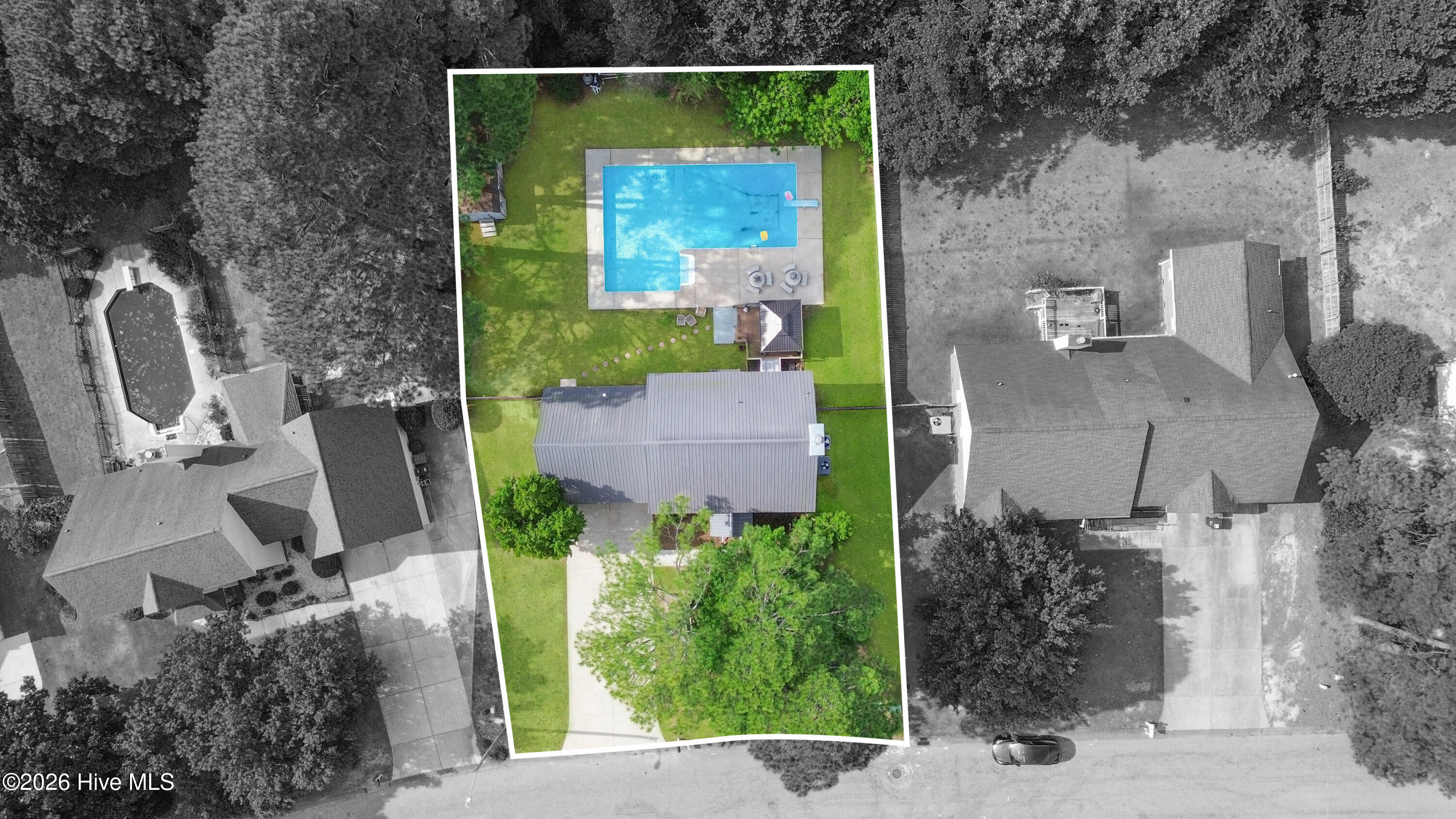 Top-down aerial drone perspective showcasing the home, in-ground pool, fenced backyard, gazebo, and outdoor entertaining spaces from above. This view helps buyers better understand the overall backyard layout, outdoor living flow, and lot configuration. Certain aerial images may include virtual enhancements and approximate property boundary illustrations which may not reflect exact survey lines.