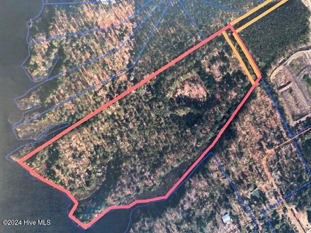 604 Shorey Drive Oriental, North Carolina A spectacular waterfront development opportunity within the Oriental town limits! 13.4 +- acres of gorgeous land on the verdant eastern shore of Whittaker Creek. You'll never find a more beautiful location this large in the Village and with such amazing potential. Zoned R-3 and awaiting your plans. The waterfront stretches OVER 830 spectacular meandering feet along the main creekside (+ additional canal frontage!) This can permit a myriad of different development ideas to take shape. Very high-density subdivision potential exists with incredible siting locations available for building lots or condominium/townhome construction! With sewer service accessible, the need for large, intrusive septic system is eliminated, leaving most of the upland areas available for improvement. There is a 60' easement connected to the NE corner of the tract. The tract is mostly wooded, with a lovely overstory of mature trees. The land lays well, with a lovely wetland fringe and a small central creek (a tributary of Whittaker Creek) offering views as well as being a positive drainage outflow from the buildable parts of the lot. The positioning of the tract on the creek is perfect. The vast water frontage faces south and west, promising cool summer breezes and protection from winter's Nor-Easters! The views are compelling, both of the settled far shore with its boats and marinas ceding the splendid vista to the widening creek and the perspective looking out across the vast Neuse River! Ever considered a large family compound? Multiple designs for subdivision are also suggested by the land's unique design. Seller may consider subdividing... Multiple homesites? One large homesite AND a separate subdivision? Let your dreams and ideas be your guide... You can have it all! This is a once-in-a-lifetime investment opportunity to own a large part of Oriental's future! Priced to SELL! Additional adjacent acreage is also available... Call for details!