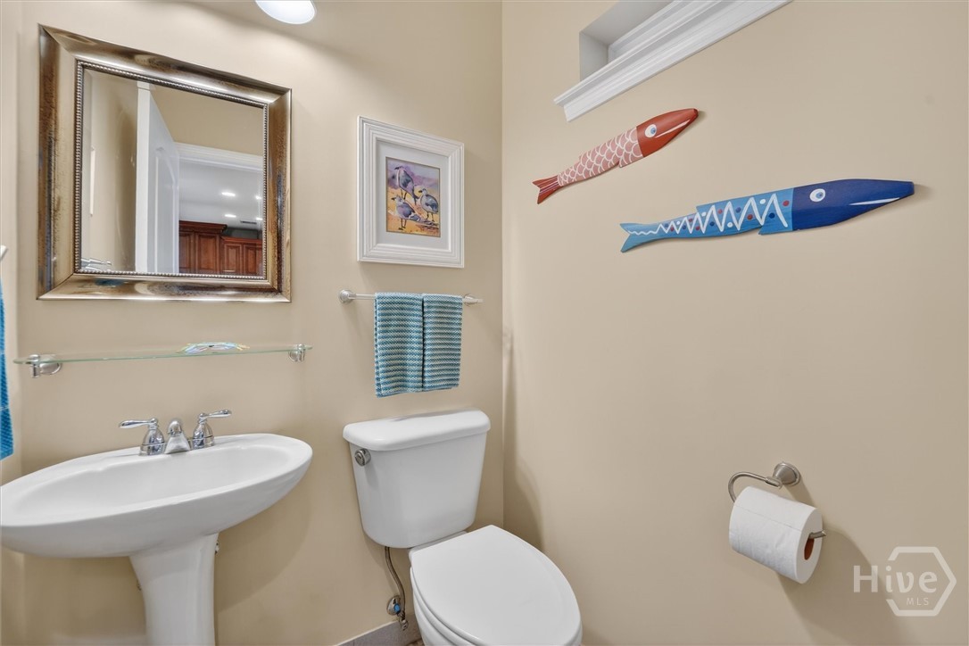 Half bath located at back entrance door, main floor