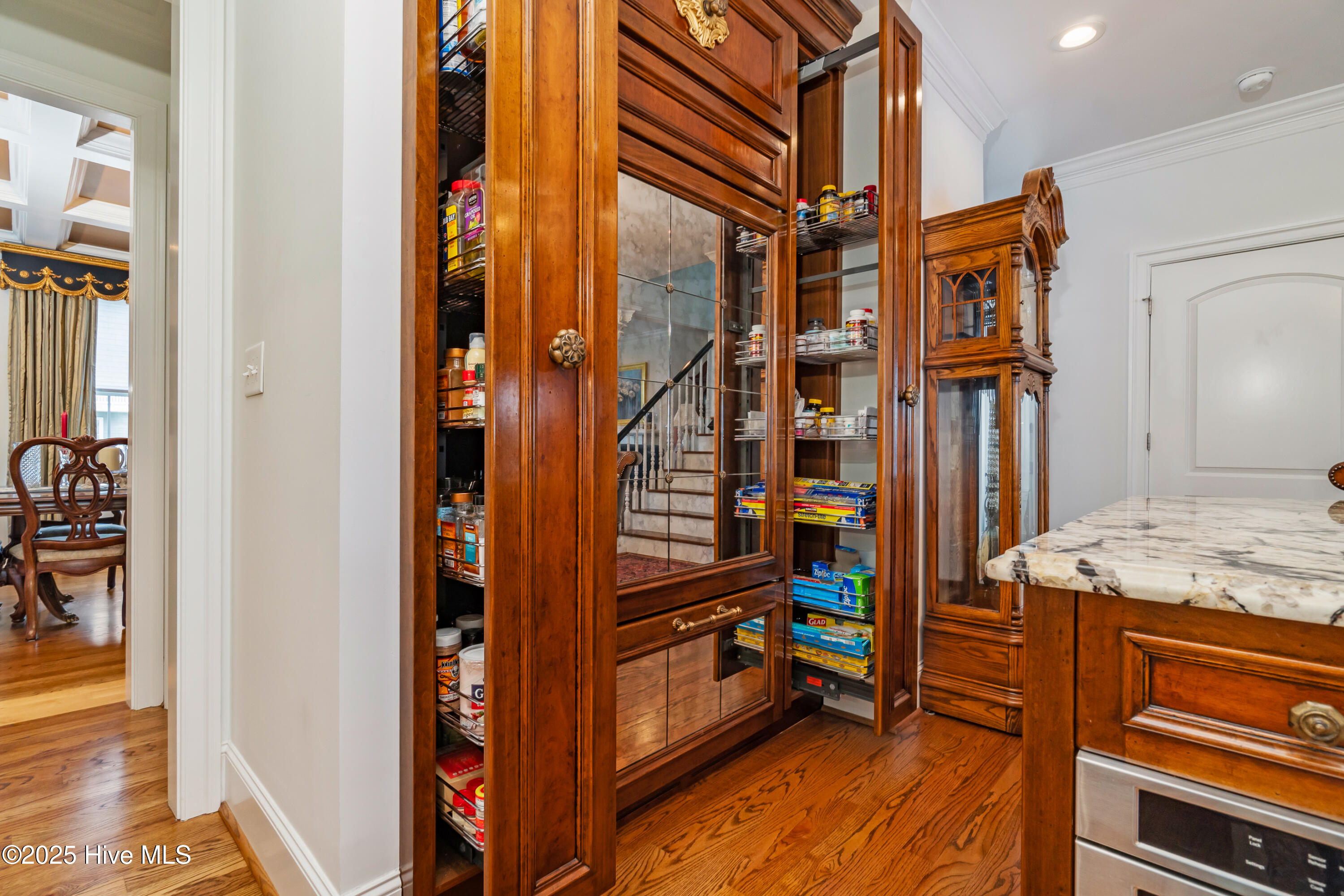 custom pull-out cabinetry and subzero fridge