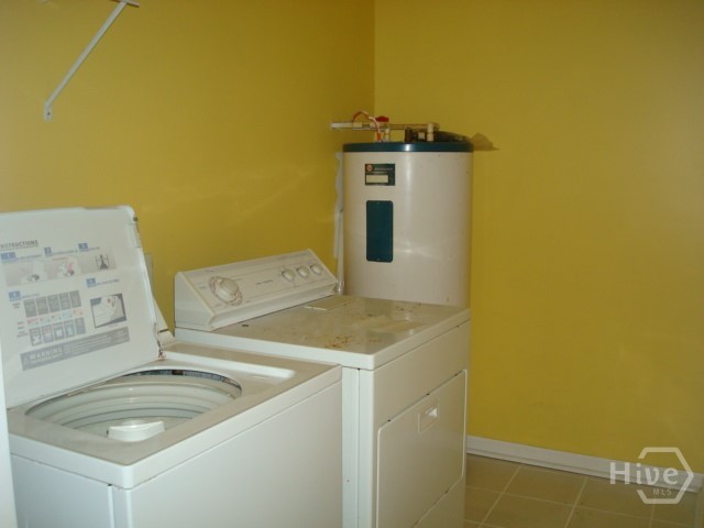 Laundry room is location for water heater.  Lots of room for storage.