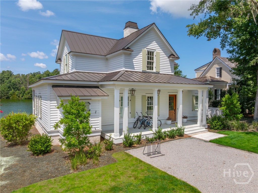 74 Birdsong Way Richmond Hill, Georgia With a premier waterfront setting on tranquil Lake Dye, this turn-key residence by Savannah’s renowned Wissmach Architects is a rare opportunity in The Ford Field & River Club’s coveted Cherry Hill Village enclave. Designed with timeless Lowcountry style, the two-level, 3-bedroom, 3.5-bath home spans 2,147 square feet and rests on a private, tree-shaded quarter-acre at the end of a quiet cul-de-sac. Inside, an entertainer’s kitchen takes center stage with a generous island, Sub-Zero and Bosch appliances, and seamless flow to the main living spaces. Outdoors, more than 570 square feet of screened and open-air porches invite year-round enjoyment of lakefront views. Just steps from Cherry Hill’s oak-lined allée, the Lake Dye pool, the Sports Barn, and the Clubhouse, this home places you in the heart of it all. Ownership includes access to The Ford’s world-class amenities—from the Pete Dye Championship Golf Course and Deepwater Marina to endless opportunities for fishing, boating, and exploring the Lowcountry landscape.