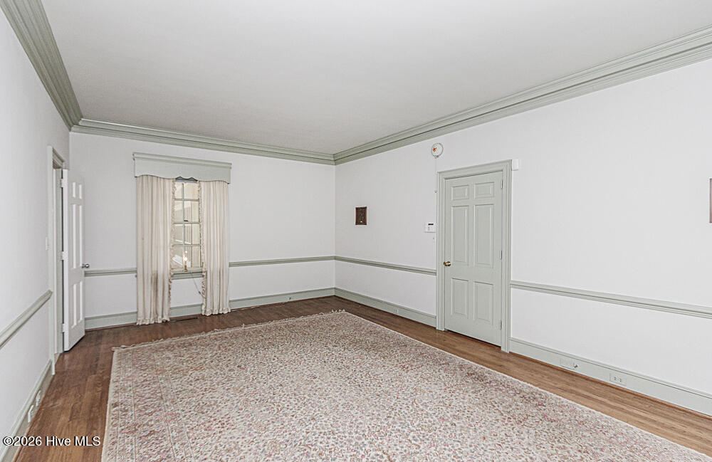 Primary bedroom with two walk in closets with built ins