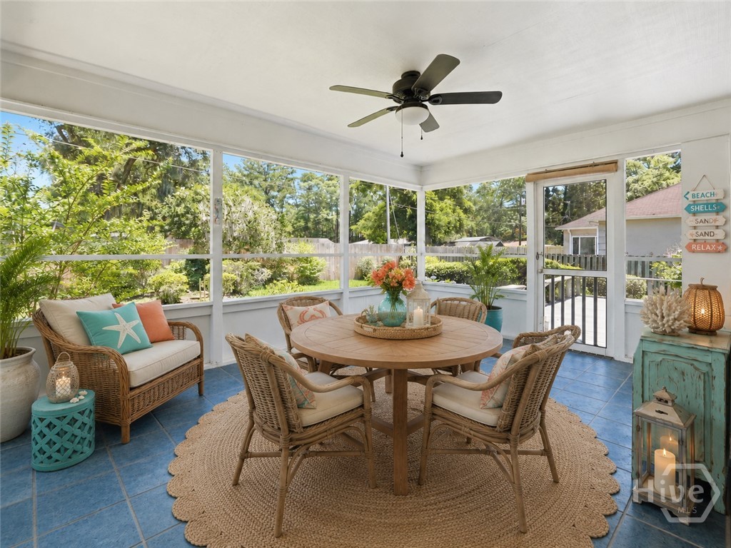 The screened porch here has been virtually staged.