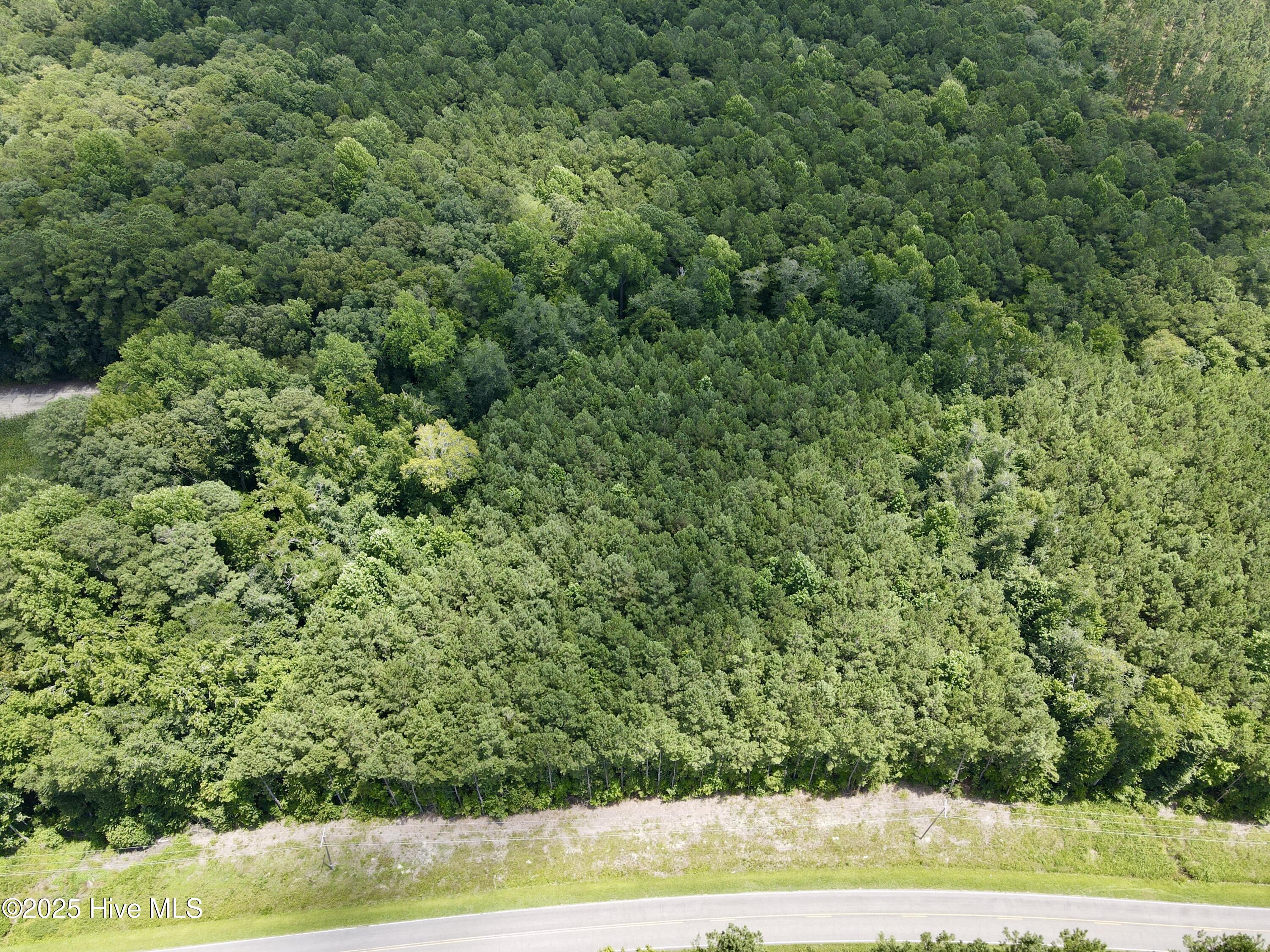 Your Dream Awaits: 2.67 Acres of Pure Paradise! Seize the opportunity to own this stunning 2.67-acre wooded haven nestled in the serene countryside of the Farm Life community. This slice of paradise offers the perfect blend of tranquility and potential, making it an ideal spot to build your dream home.
The groundwork is already in place! A site soil test has been completed, paving the way for a septic permit, and a brand-new survey is on file. While well water and septic are required, the possibilities for creating your perfect retreat are endless.
Light restrictions ensure the charm and quality of the area are preserved: no mobile homes, and a minimum of 1,800 sq. ft. for stick-built homes.
Don't let this rare gem slip through your fingers—secure your piece of paradise today before it's too late!