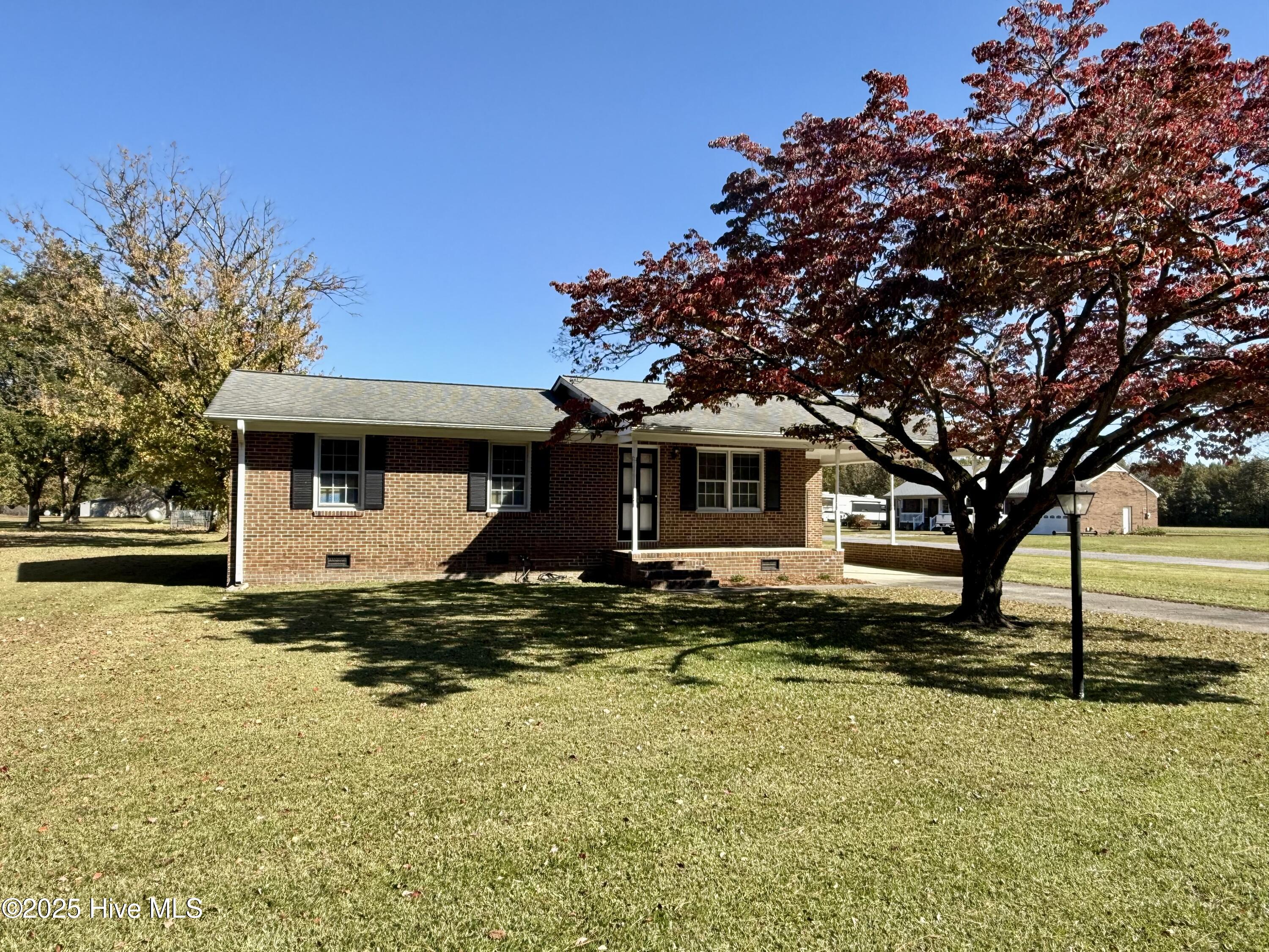 Charming Brick Home on a Corner Lot in Robersonville!Discover the perfect blend of classic charm and modern comfort in this delightful 3-bedroom, 1-bathroom brick home, ideally situated on the edge of Robersonville. Offering 1,000 square feet of cozy and inviting living space, this property is a true gem waiting to be discovered.Step inside and be greeted by the warmth of original hardwood floors that flow through the spacious living room and comfortable bedrooms. The heart of the home, the kitchen, comes fully equipped with a refrigerator and electric range, and features an adjacent dining area perfect for your morning coffee or evening meals. For your convenience, all appliances, including the washer and dryer located in the dedicated laundry room, are included with the sale.This home has been thoughtfully updated to ensure year-round comfort, featuring a modern bathroom and an efficient central HVAC system. Outside, you'll appreciate the practicality of the attached carport and cement driveway, providing ample off-street parking. Situated on a desirable corner lot, the property offers a wonderful sense of space and curb appeal.This cute and cozy home offers an incredible opportunity that you won't want to miss. It's move-in ready and waiting for you to make it your own.Don't let this home pass you by. Call today to schedule your private showing