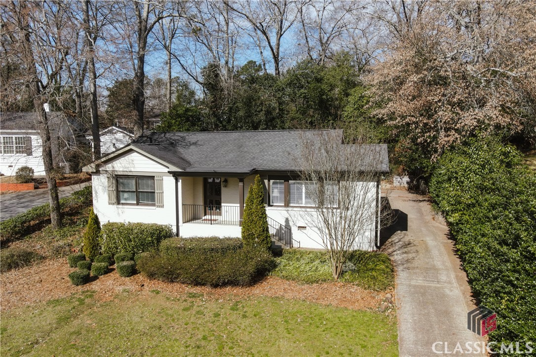 This incredible renovation in Five Points is within a short walking distance to all of the fabulous retail and dining that Five Points has to offer, the Memorial Park walking trails and zoo, as well as the Intramural Fields and UGA athletic facilities. This fully renovated 3 bedroom, 2 1/2 bath home is perfect for the buyers wanting it all! New windows, roof, systems, kitchen and baths are just the beginning. Upon entering, you are welcomed by a spacious foyer which opens into the graciously sized living/dining combo and bright white kitchen, flooded with natural light from the numerous windows overlooking the front lawn. The kitchen boasts white quartzite countertops, custom backsplash, large pantry and peninsula with bar seating. Your buyers will thank you for taking them through this precious cottage which boasts a sprawling owner's suite with a separate sitting area accented by an electric fireplace, along with a large, spacious bath. A large shower with frameless glass and separate soaking tub along with a double vanity and private lavatory round out the primary suite! The enormous owner's closet has space for a dresser and desk if so desired.  The sizable secondary bedrooms share a beautifully renovated full bath with penny tile floors, a tub/shower combo and single vanity. The rear of the home has a large deck for grilling, entertaining and tailgating and provides access to a pebble/stone patio currently used as a small fire pit area. Don't miss out on this incredible opportunity to be in Five Points at a spectacular price!! xx