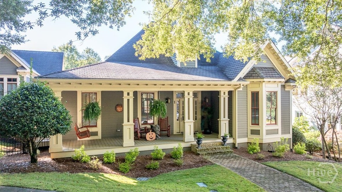 Impressive one level upscale home fits the "Royal" address it occupies. Recent renovations have added additional charm to this three bedroom two bath home with high ceilings and beautiful trim throughout. Front and back covered porches provide outdoor enjoyment for all seasons.  Windows in every room bring natural light into the open floor plan, enhancing the ambiance throughout. Entering the foyer with a distinctive chandelier, there is an office/library through doors on the left and the guest bedrooms are to the right with a bath in between. The fireplace with stone surround is the focus of the living area. The ample dining area features a designer's chandelier and opens into the kitchen. Polished marble countertops and top-of-the-line appliances along with well appointed cabinets and exceptional lighting details highlight the upscale kitchen. The utility room is adjacent to the kitchen and offers storage, washer/dryer connections, a sink with cabinets above and access to the side yard. The owners suite is a welcoming retreat enhanced by the totally renovated bath with porcelain plank flooring, free standing soaking tub with a filler and sprayer and shower complete with custom barn glass doors, stainless shower product shelf and large format porcelain tiles up to the 10 ft ceiling. A walk-in closet, a quartz vanity with dual sinks, ceiling lights on dimmers and designer chandelier over the soaking tub are some of the special features and upgrades. The two-car garage is accessed via the rear porch and has a walk up attic for storage and option to add finished square footage for additional uses. The neighborhood offers sidewalks for walking, an amenity area and easy access to adjacent restaurants and stores along with access to downtown Athens and Interstate access.