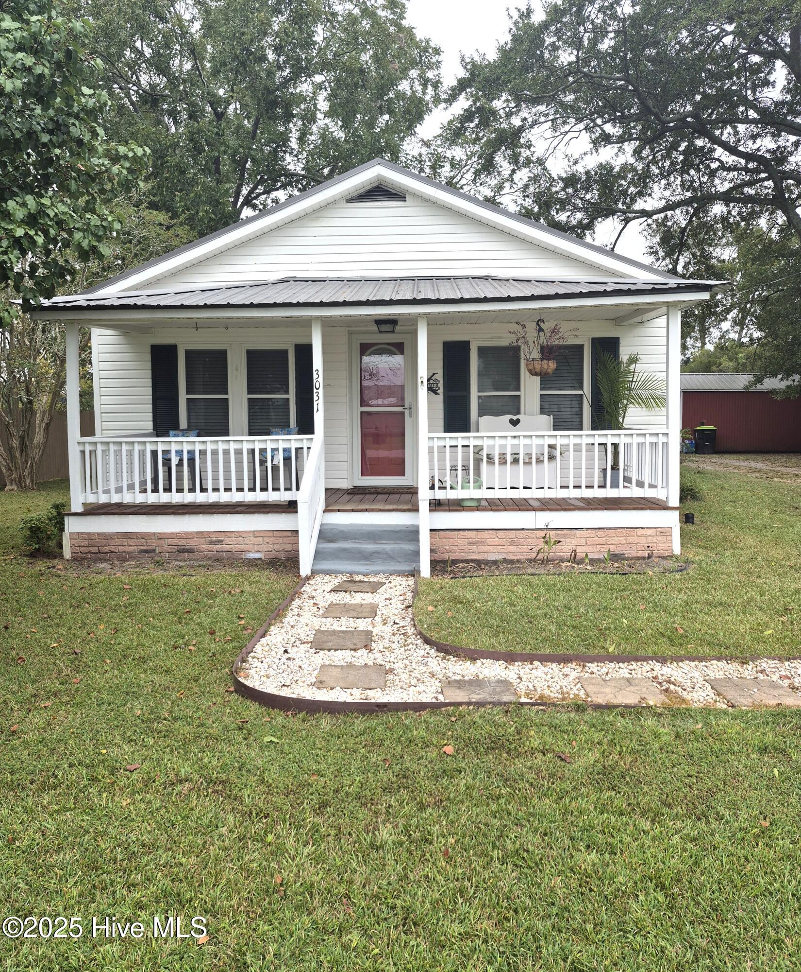 Welcome to the paradise!  Enjoy the peaceful country setting. Home has lots of improvements and updates.  The metal roof is approximately 5 yrs old, HVAC is approximately 3 yrs old and Water heater is about  2 yrs old.  The bathroom has been completely redone, upgraded appliances, new fans and new doors.  There is a white oak hardwood floor in the den under the carpet.  The attic has a 12 inch insulation with thermostat control. Out in the back yard, there is a storage barn and a shed that can be used as a  man cave or a workshop.  It also has a RV hookup with 50 watts and septic ready.  Its minutes from Bear Grass community and Williamston.