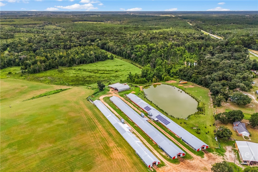 Aerial view of farm, 35 foot deep pond & grow hous