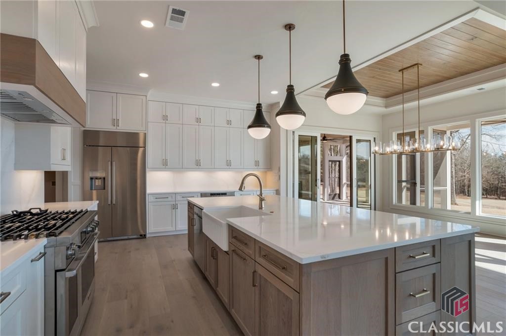 Kitchen - High End Lighting and Large Bar