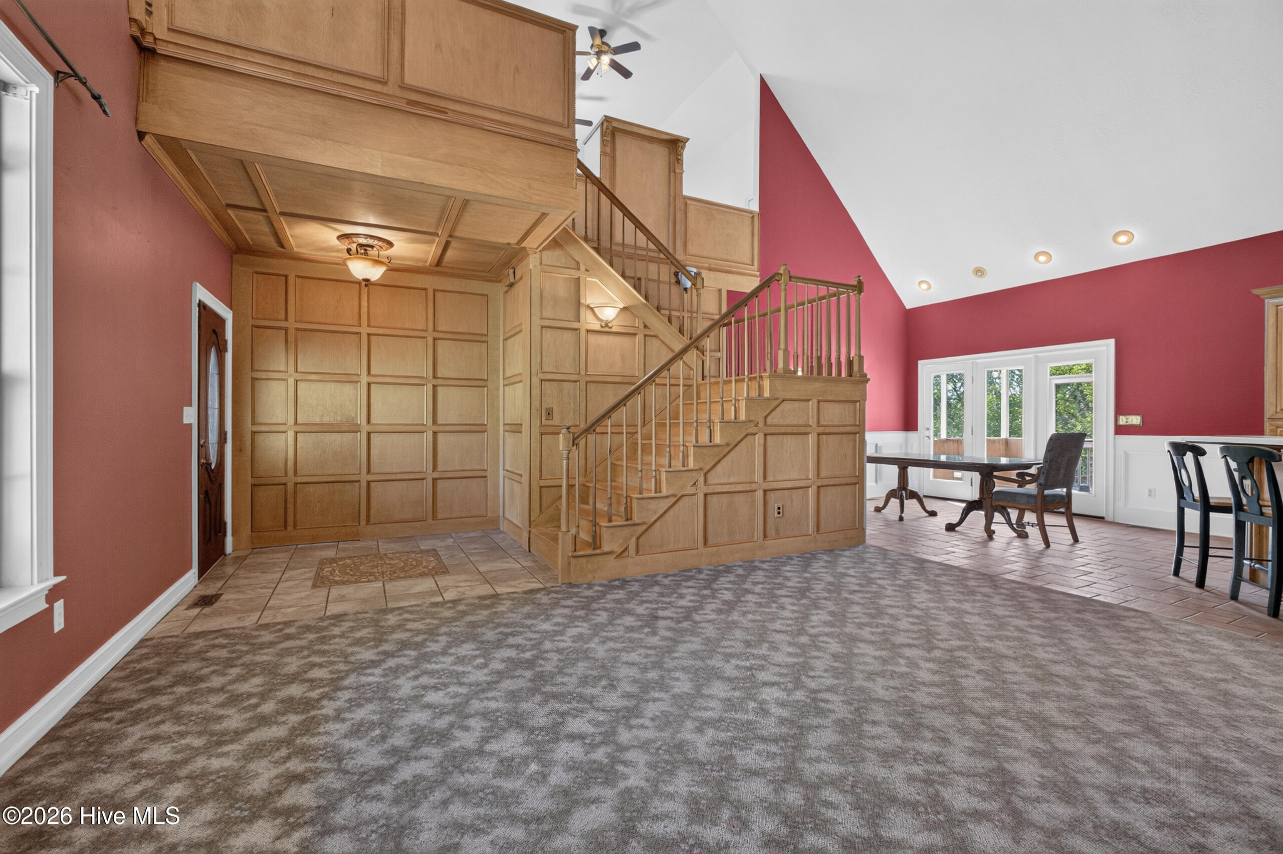 Decorative wood walls is a doorway into Owner's Suite