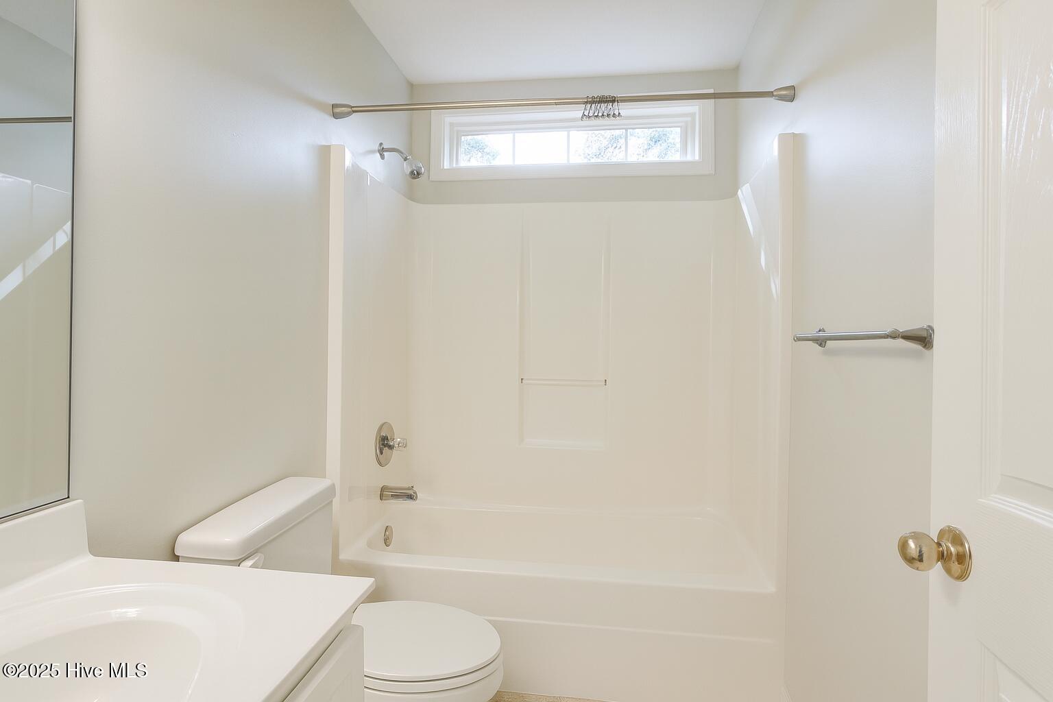 9117 Landing Drive SW, Calabash, NC 28467 – photo 22: Bright Bathroom with Natural Light