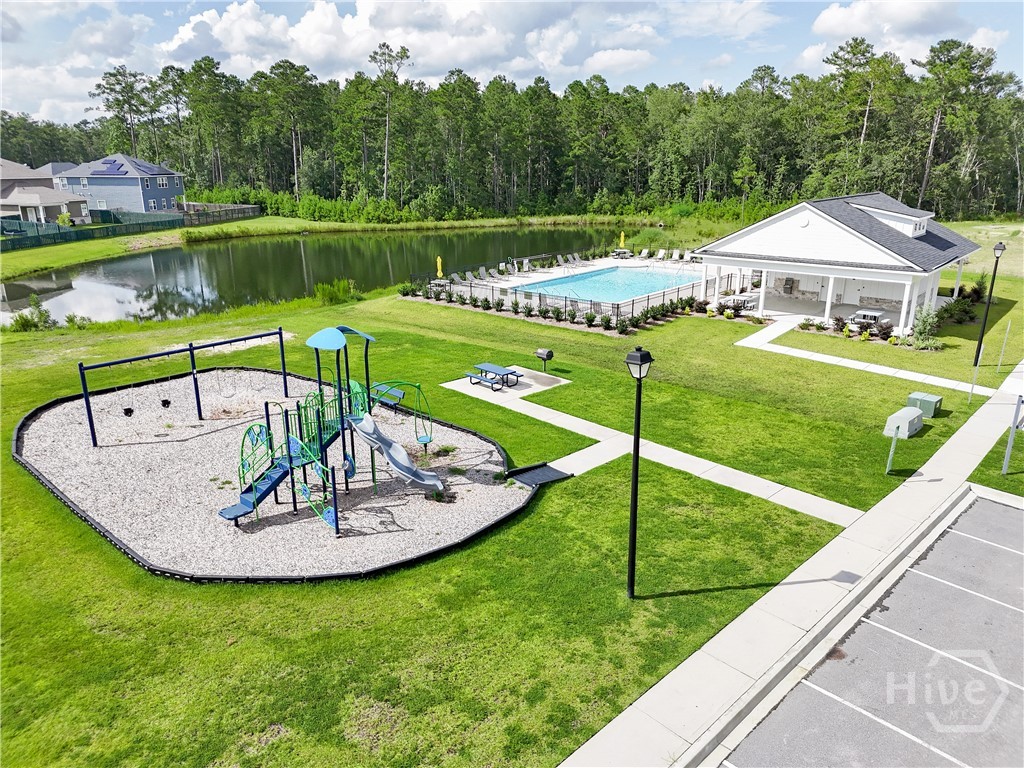 Community amenity center features a pool, cabana and playground.