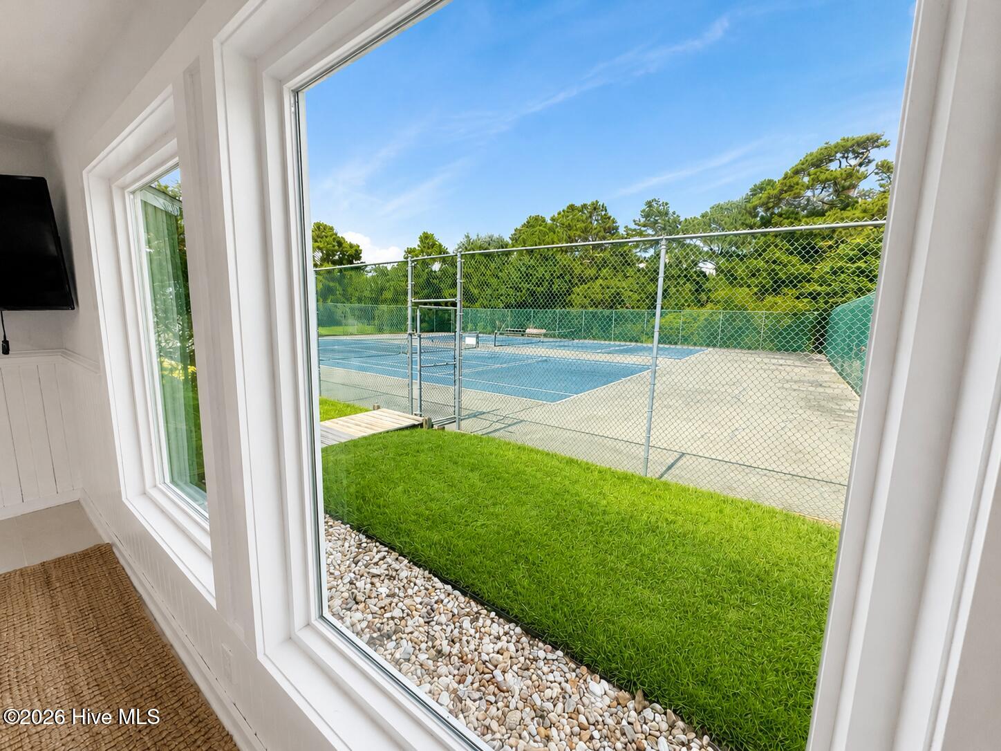 Cape Emerald's clubhouse with tennis and pickleball courts