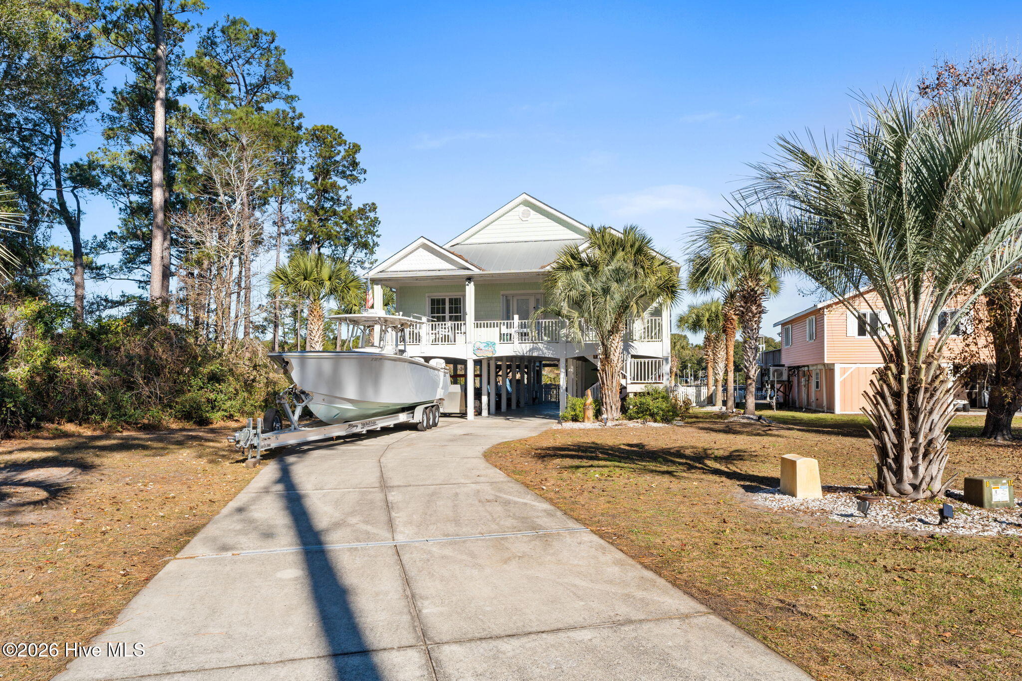 Imagine life on the ICW. Now imagine your boat at your fingertips on a 27,000 lb boat lift and a pool to relax in whenever you want. Not only is this 3 bedroom, 2 bath home located on one of the most desired streets on Oak Island, but the outdoor space provides for a whole world of entertaining possibilities. Whether this is a primary or second home or an investment property, it is sure to bring a smile to your face with the amazing views and personal outdoor oasis. Tons of under-home storage, parking and a driveway for all the toys. Come check it out for yourself.