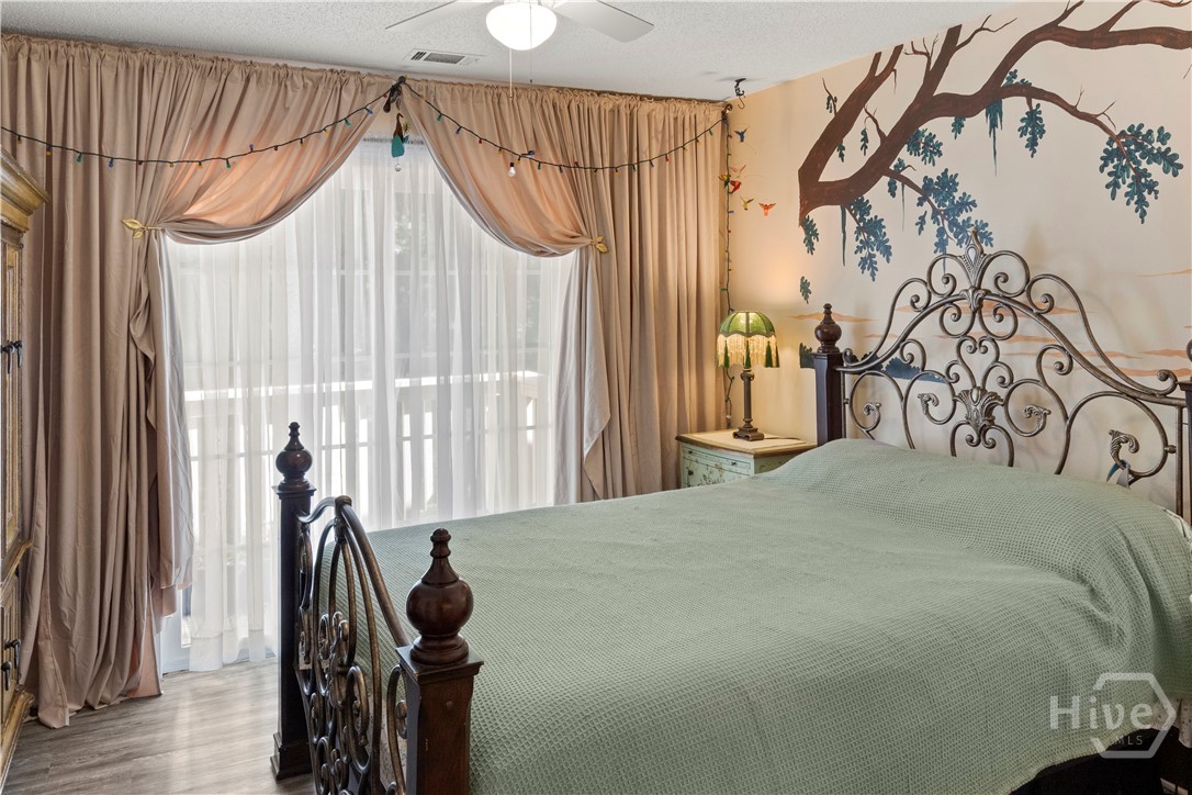 Bedroom with hand painted mural