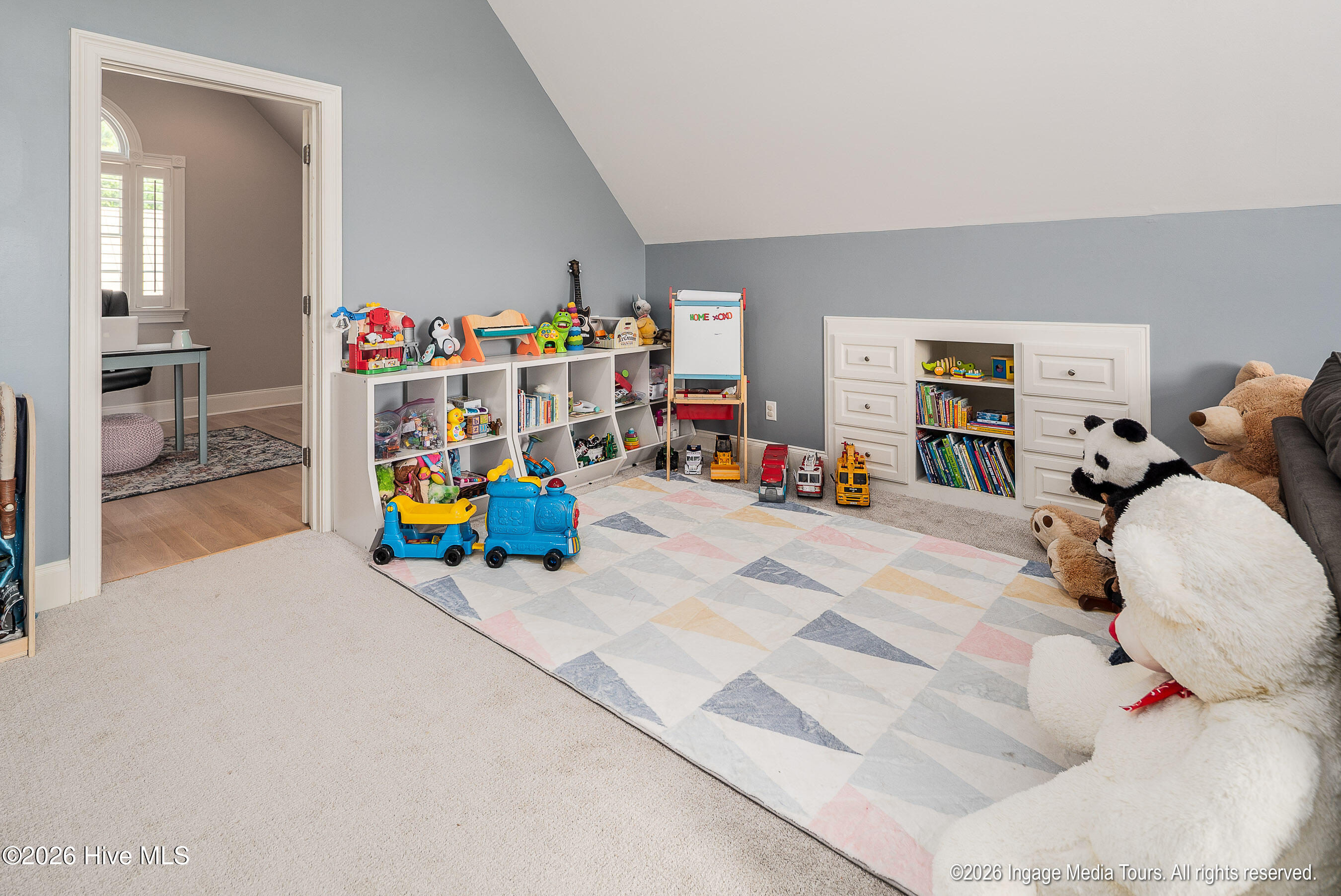 Bonus room play area with entry to office.