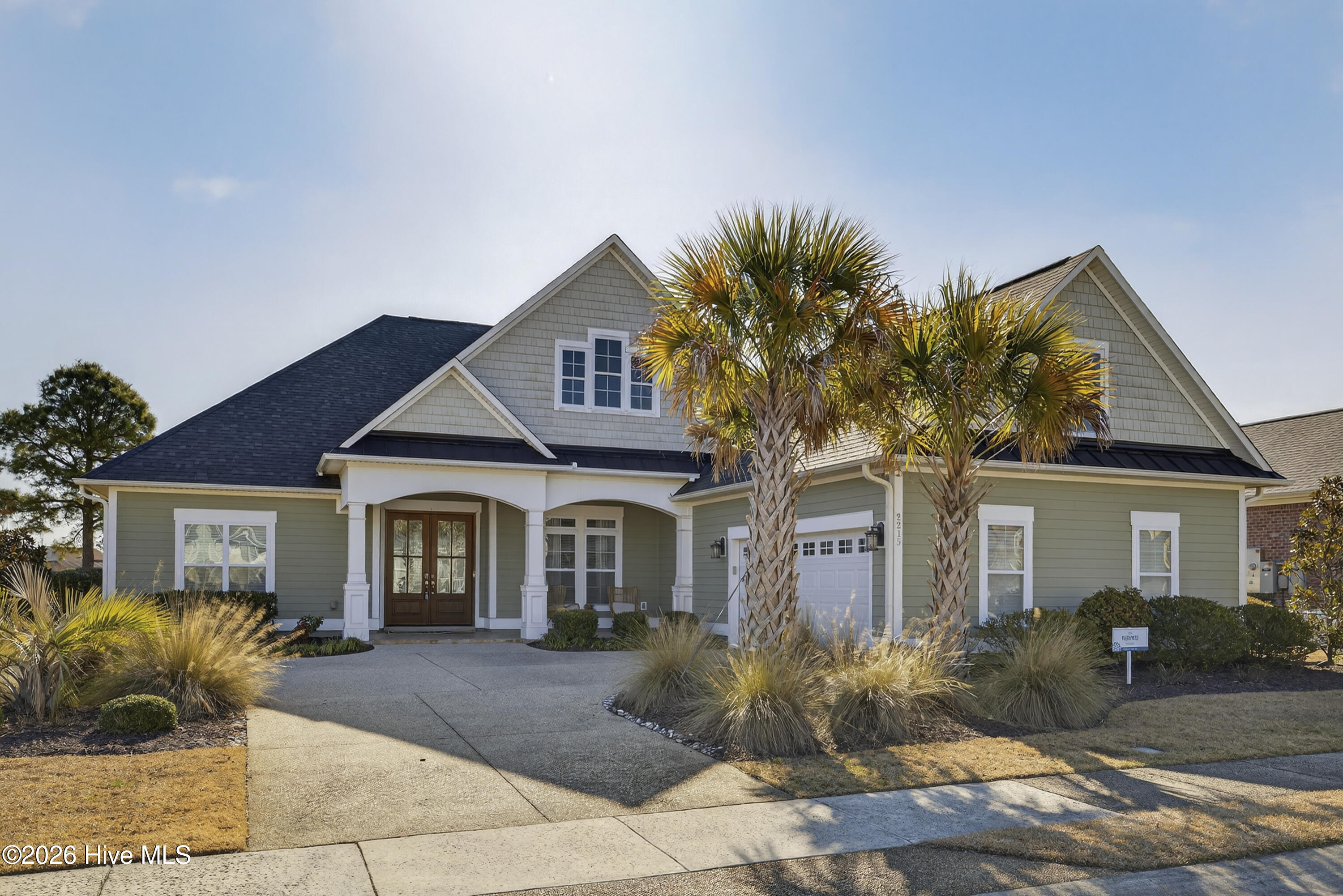 Beautifully appointed home with stunning fairway views overlooking Hole 7 of the Compass Pointe Golf Course. This thoughtfully designed residence offers three first-floor primary suites, each with its own private bath—ideal for comfort and guest privacy. The open floor plan features a chef's kitchen with an expansive island, prep station, double ovens, and two pantries, seamlessly flowing into the spacious living room with a fireplace flanked by custom built-in bookcases. Adjacent to the living area is a generous home office, providing an inspiring work-from-home setting. The living room opens to a large screened-in lanai and a fully fenced backyard, perfect for outdoor enjoyment. The upper level includes a bonus room with a full bath and walk-in attic storage. An oversized two-car garage easily accommodates vehicles and a golf cart. A rare opportunity—this exceptional home is a must-see and won't last long.