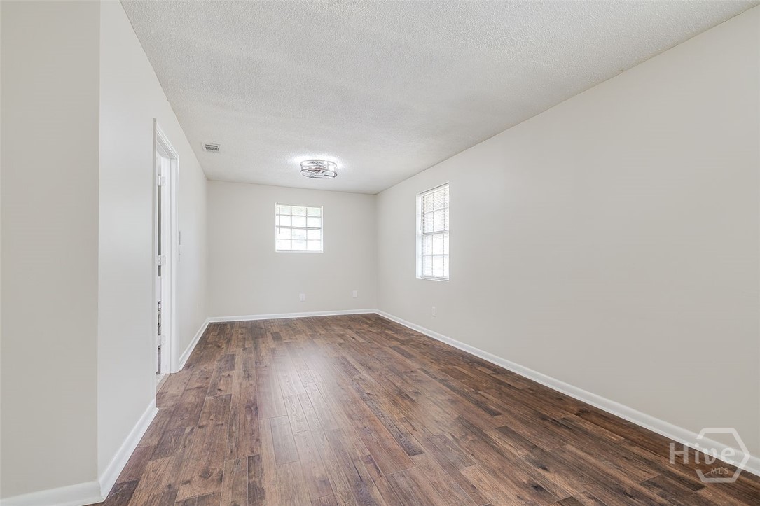440 Pecan primary bedroom features 2 ceiling fans