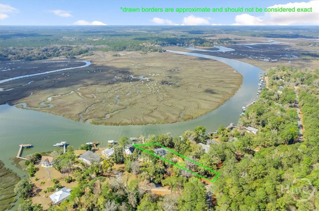 Aerial View of River and Marsh of Home at 2713 Julienton Drive NE, Townsend GA outlined in green.