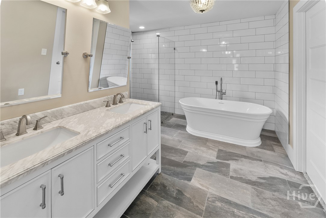 elegant master bath with separate tub and shower