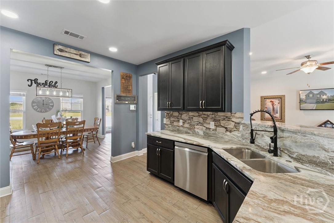 Kitchen with formal dining room to left.
