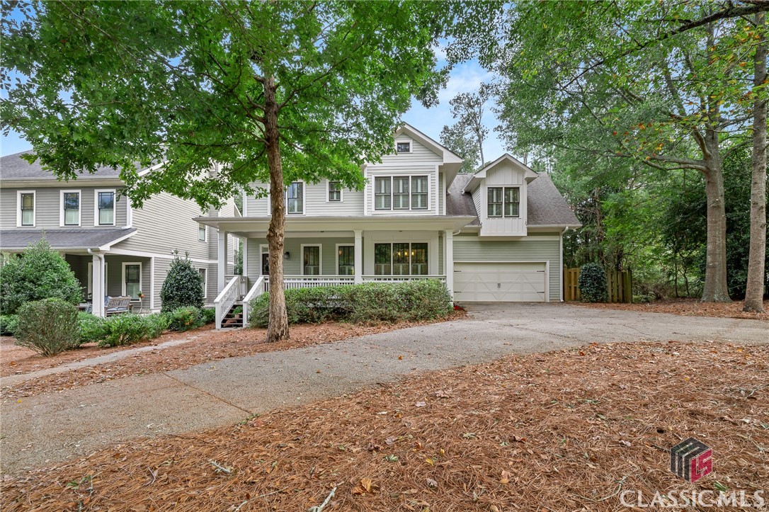Welcome to your own private in-town retreat! You will feel like you are vacationing in your mountain getaway while relaxing in this newer custom built home in Beech Creek Preserve, just minutes from Five Points, UGA and downtown Athens. Enter the home through from the rocking chair front porch into the foyer, flanked by an office or flex space and the dining room. Beyond, there is a large open living room and kitchen including built ins, fireplace, large kitchen island with breakfast bar, tile backsplash, stainless appliances including a new refrigerator. The deck overlooks the large fenced in back yard. Large breakfast area with great natural light and mud room off of the oversized garage. Upstairs are the bedrooms, all with hardwood floors except the 4th bedroom that also makes a great bonus room! The oversized owner's suite features a spacious tiled shower, jetted tub, granite counter top, double vanity and a large walk-in closet. There is a full unfinished walk-out basement will fulfill all of your storage needs and there is  a patio off the basement. Great in-town living awaits!