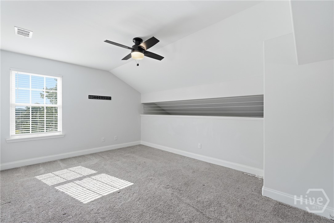 The loft above the primary suite is light and airy.