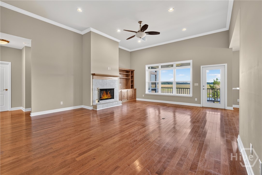 Solid wood hardwood floors throughout. NO CARPET! Living room overlooking the Georgia Coast.