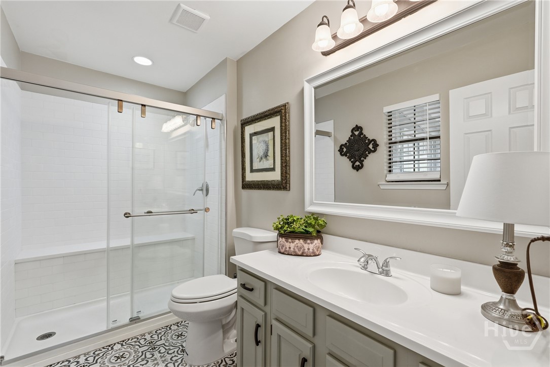Primary bathroom 2 with walk-in shower and beautiful tile floor
