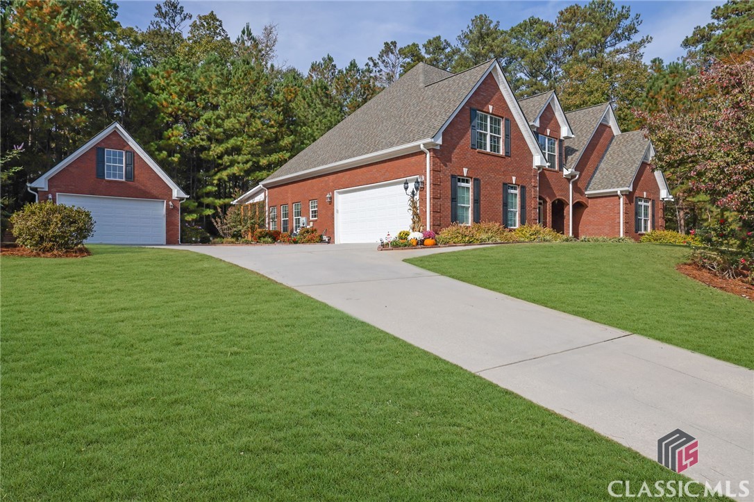This immaculate 4 sided brick ranch with a 4 car garage is a great floorplan. The primary suite is on the main level along with 2 other bedrooms. Upstairs you have a bonus room with another bedroom and full bathroom. The large living room has a double sided fireplace into the sunroom that overlooks the private backyard. The large kitchen has an island and has plenty of room for entertaining large parties. The screened porch off of the back of the house is a favorite spot for your morning coffee or a glass of wine. Run to this house before it is gone!