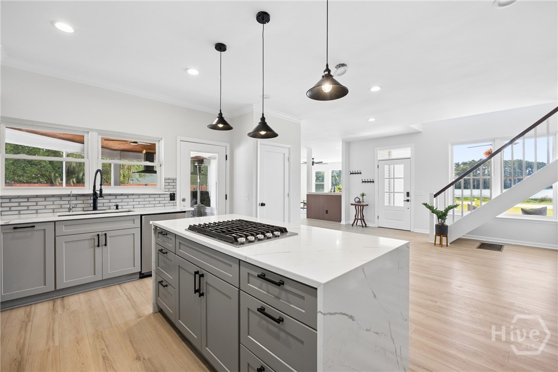 Open kitchen, welcoming an extra dining area -- versatile for however you choose to use it