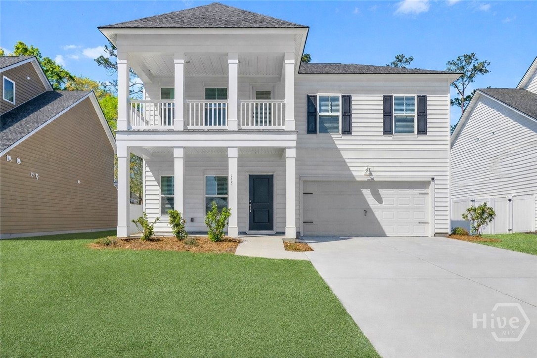 Some homes make you choose between space, privacy, and flexibility. 245 Lillian Street delivers all three. A flexible 5-bedroom, 3.5-bath layout sets this Southern charm home apart, along with up and downstairs owner suite options, a covered balcony, and a backyard fenced on three sides. The main-level primary suite is tucked toward the back of the home and overlooks the backyard. LVP flooring and tile run throughout the main level. The open kitchen features chic white cabinetry, quartz counters, a gas stove, stainless appliances, and a brand-new French door refrigerator with bottom freezer, anchored by a formal dining room. Upstairs, a spacious secondary suite offers a dual-sink ensuite, while another oversized bedroom includes its own ensuite and ample space for a workspace, sitting area, or playroom. Located near Ebenezer Elementary and Ebenezer Middle Schools, with easy access to Pooler, Savannah, Hilton Head, and the everyday shopping, dining, and conveniences Rincon has to offer!